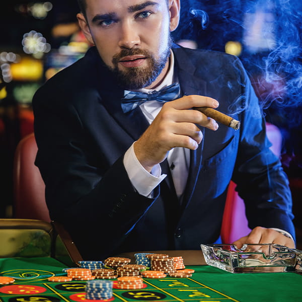 Handsome man playing in casino