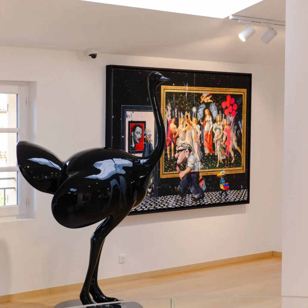 Interior of Eden Gallery with a black sculpture set before a large contemporary canvas Interior of Eden Gallery with a black sculpture set before a large contemporary canvas