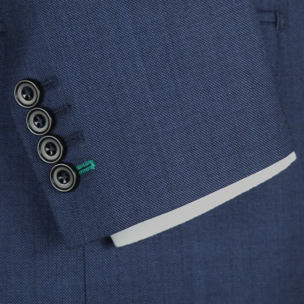 Working cuff buttons on a navy jacket at Leonard Jay, the outfitter on New Bond Street Working cuff buttons on a navy jacket at Leonard Jay, the outfitter on New Bond Street