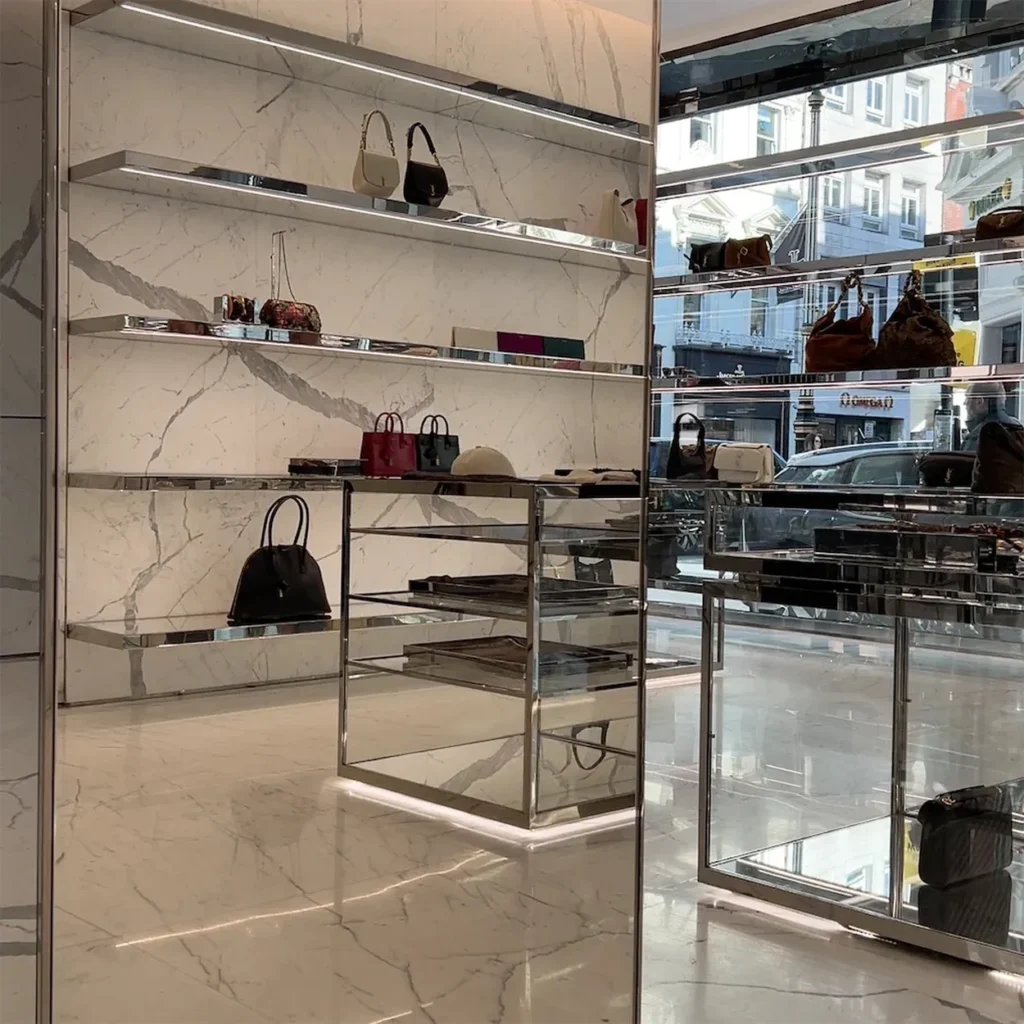 Handbags on marble shelving inside the Saint Laurent store on Old Bond Street Handbags on marble shelving inside the Saint Laurent store on Old Bond Street