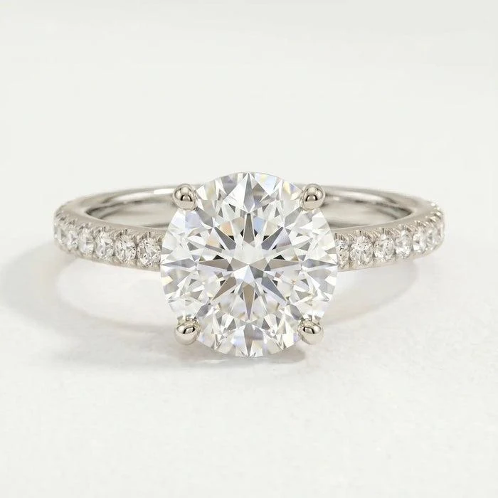 Macy engagement ring in 18ct white gold with a round lab-grown diamond in a four-claw setting and micro pave shoulders