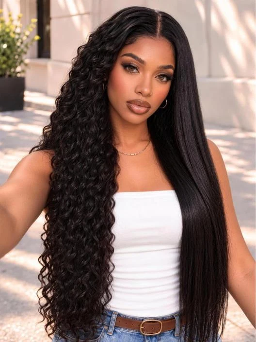The Beauty of Natural Waves: Finding a Hairstyle That Balances Elegance and Versatility Woman with long dark hair worn curly on one side and sleek on the other, in a white top and denim