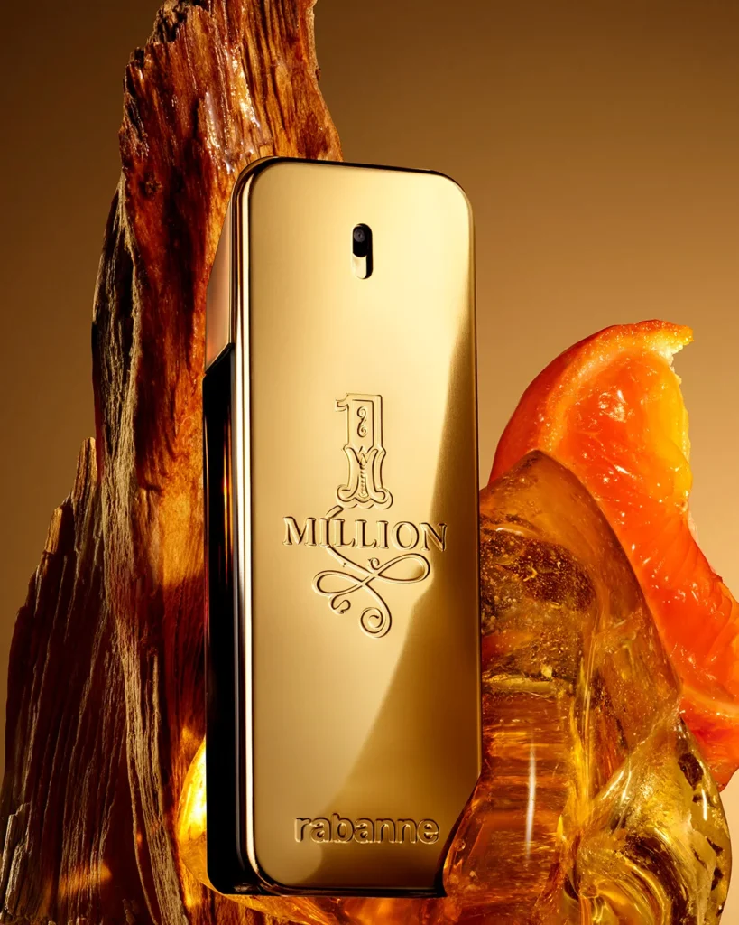The gold bar bottle of Rabanne 1 Million beside amber resin and blood mandarin